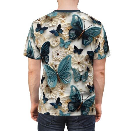 Teal and dark blue butterflies and cream and tan flowers cover this all over print t-shirt, creating a vibrant nature-inspired design.