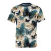 A white t-shirt with a repeating pattern of teal and navy blue butterflies amidst cream and light tan floral designs.