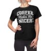 Black graphic t-shirt with 'Coffee Makes Me Nicer' text, featuring daisy graphics and a checkered lightning bolt.