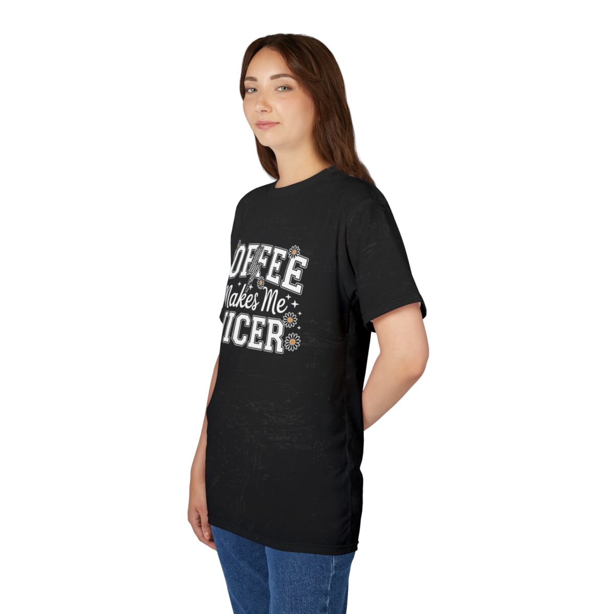 White text and daisy graphics cover this black tee shirt, displaying the phrase "Coffee Makes Me Nicer".