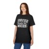 White collegiate lettering and small daisy graphics cover this black tee, with a checkered lightning bolt graphic.