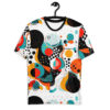 Bold geometric shapes in red, teal, orange, and black cover this sublimation graphic tee, with scattered dots and checkered patterns.
