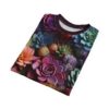 Vibrant all over print sublimation tee showcases a colorful arrangement of assorted succulents in pink, purple, teal, and orange hues.