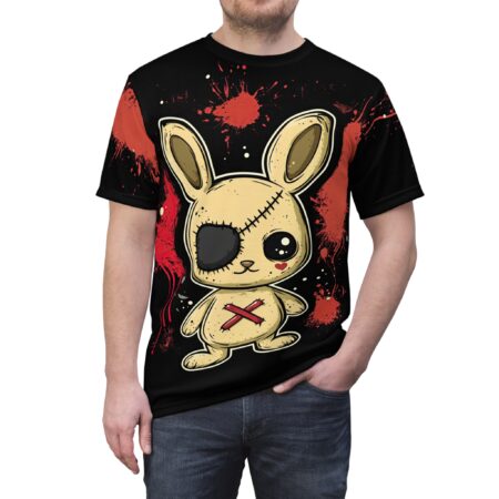 Red splatter patterns and white dots cover this black tee shirt, featuring a stitched, one-eyed bunny with an eyepatch and a red X.