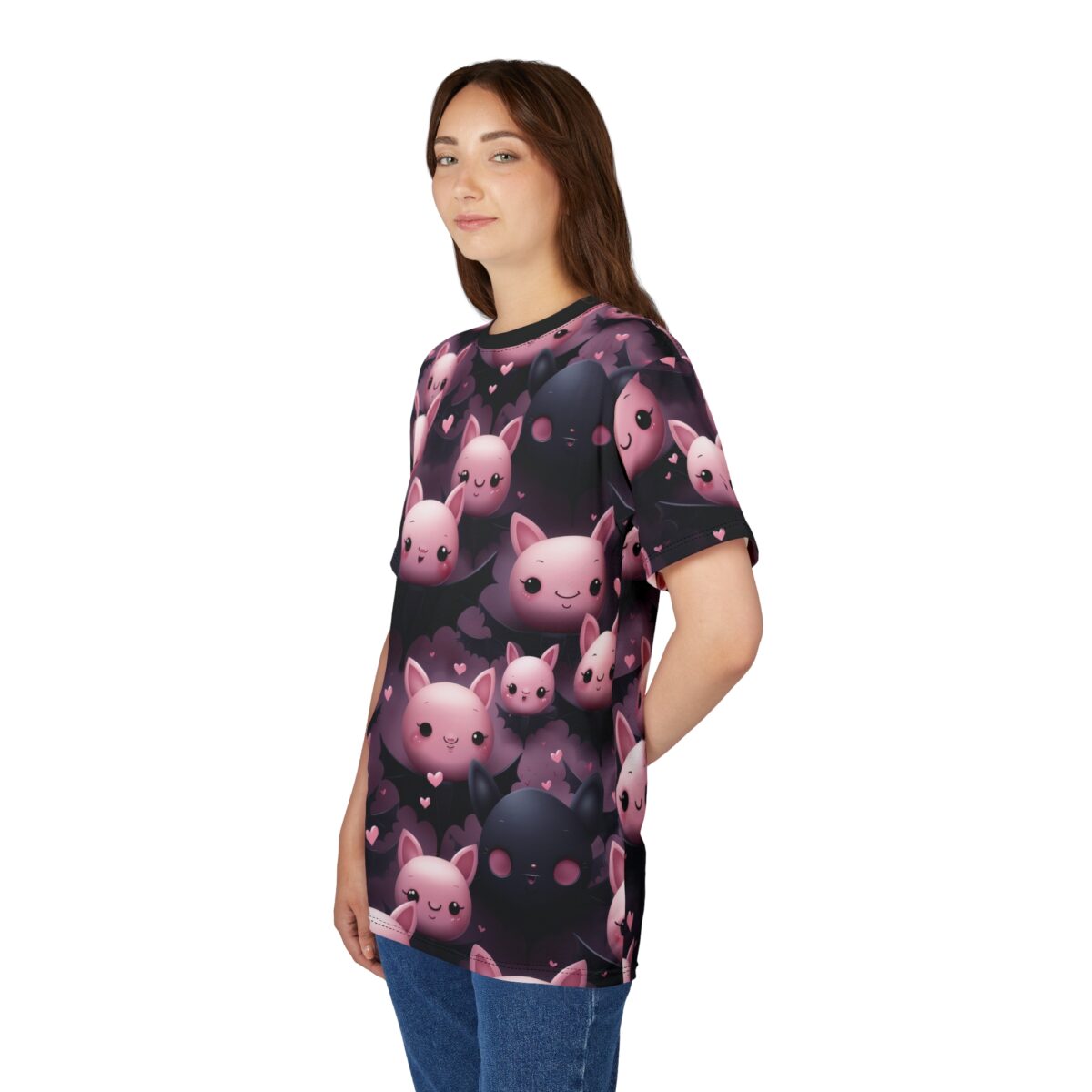 Woman wearing a t-shirt printed with pink and black cartoon bats