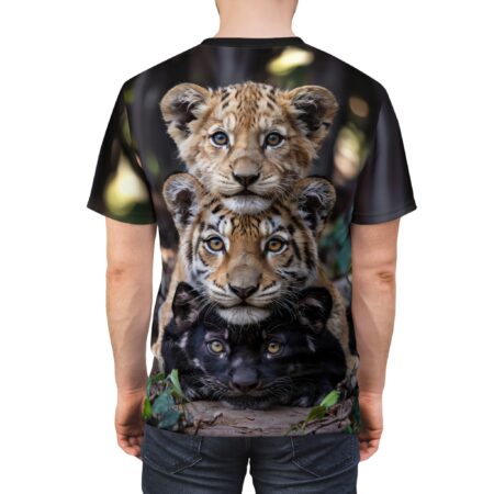 Detailed fur textures and piercing eyes of a stacked tiger cub, tiger, and panther design cover this sublimation graphic tee, set against a blurred forest background.