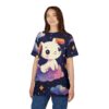 A young woman wearing a dark blue t-shirt with a cartoon white dog sitting on a colorful cloud. The t-shirt design features a starry night sky with clouds and stars.