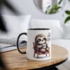 A white ceramic mug with a black rim and handle, featuring a cute sloth illustration holding a coffee cup.