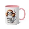 White ceramic mug with a pink handle and interior, featuring a cute sloth saying "I Need Coffee".