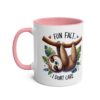 White ceramic mug with a pink handle and interior, featuring a sloth hanging from a branch with the text "FUN FACT" and "I DON'T CARE".