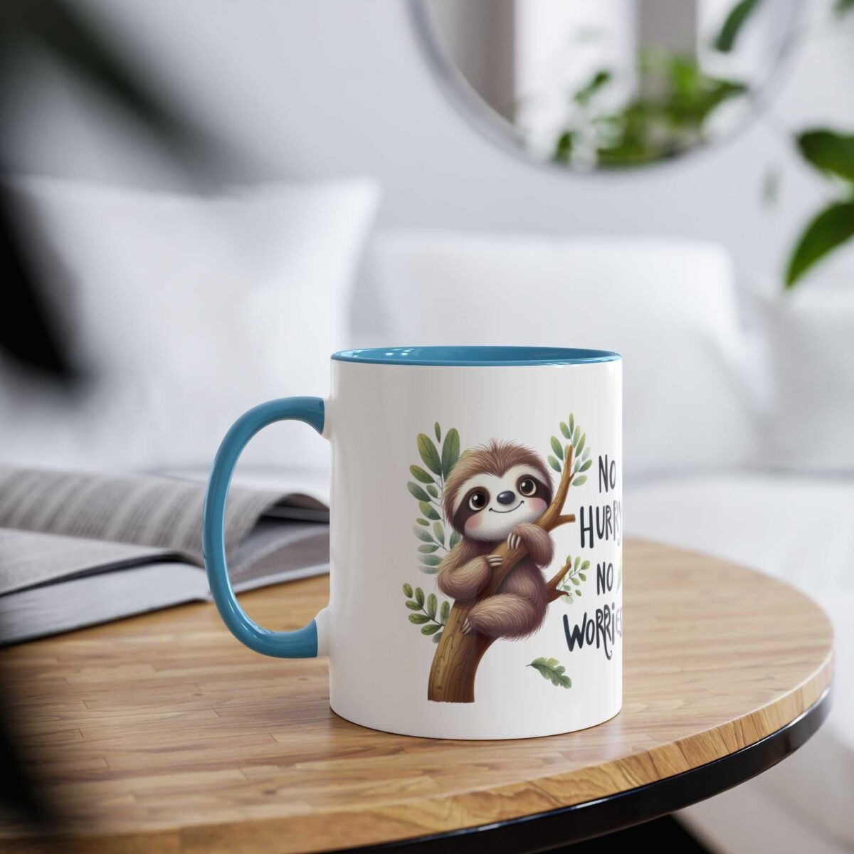 White mug with blue rim and handle, featuring a cute sloth on a branch with leaves and text.