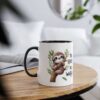 A white ceramic mug with a black rim and handle, featuring a cute sloth illustration on a branch with leaves and the text "NO HURRY NO WORRIES".