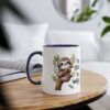 A white ceramic mug with a dark blue rim and handle, featuring a cute sloth illustration on a branch with text.
