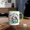 White ceramic mug with a lime green interior and handle, featuring a cute sloth sleeping on a turtle.