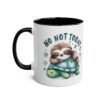 White ceramic mug with black handle and rim, featuring a cute sloth sleeping on a turtle.