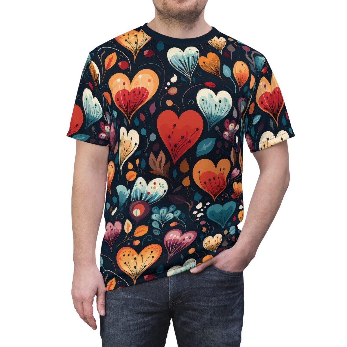 A man wearing a dark t-shirt with a repeating pattern of stylized, colorful heart-shaped flowers and leaves.