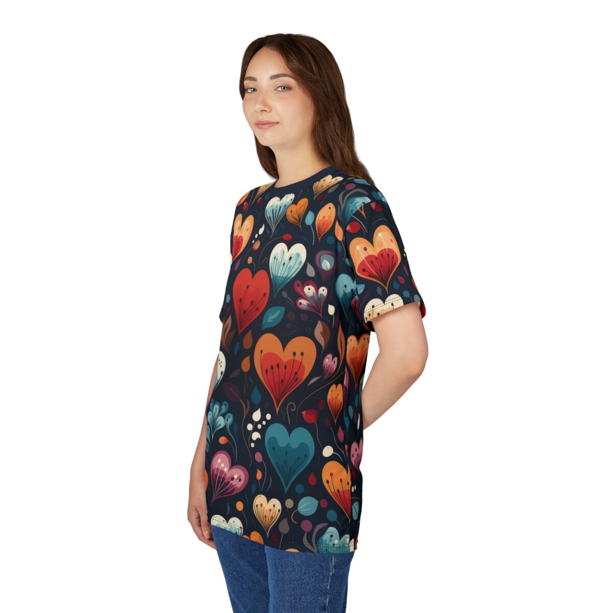 Vibrant red, teal, and orange hearts with petal-like details cover this 3D graphic t-shirt, set against a dark background with floral accents.