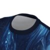 Deep blues and swirling white patterns cover this oversized full print tee, depicting a cosmic vortex with bright, luminous orbs.