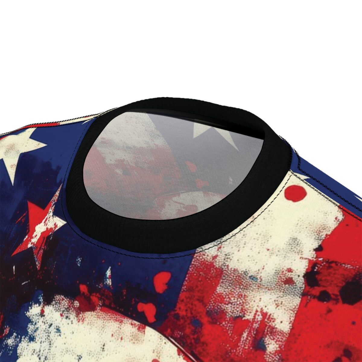 Close-up of a t-shirt featuring a distressed American flag design with grunge paint splatter effects and a black collar.