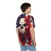 A person wears a t-shirt with a distressed American flag and screaming skull design, viewed from the back on a white background.