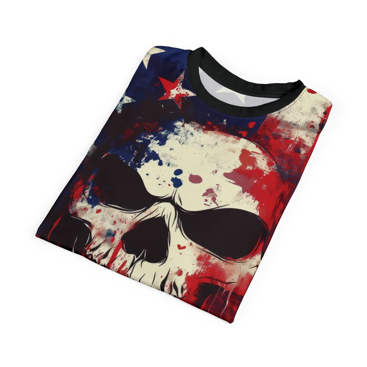 A folded t-shirt featuring a grunge-style skull graphic, incorporating red, white, and blue colors with star elements on a light background.