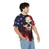 A person wears a distressed t-shirt with an American flag and skull design. The apparel features patriotic colors and a grunge aesthetic.