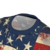 Close-up of a t-shirt's navy blue collar and shoulder area, featuring a distressed American flag pattern with faded stars and stripes.