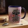 Ceramic coffee mug with 'Just a Mom Who Rescues Dogs' text, paw print, and floral design.