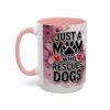 White coffee mug with pink handle and interior, featuring 'Just a Mom Who Rescues Dogs' text and floral graphics.