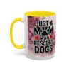 Ceramic mug with pink floral background, featuring bold text 'JUST A MOM WHO RESCUES DOGS' and a yellow handle.