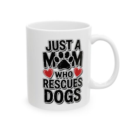 White ceramic mug with 'Just A Mom Who Rescues Dogs' graphic, featuring paw print and red hearts.