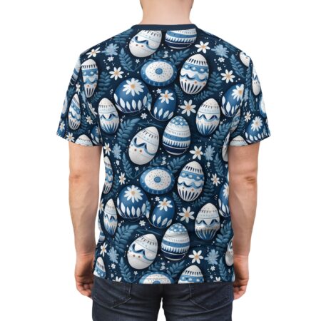 Blue floral patterns and intricately decorated Easter eggs cover this graphic streetwear tee, on a dark navy background.
