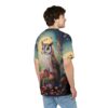 A regal owl perched on mushrooms beneath a glowing moon, with butterflies and flowers scattered across the dark, starry sky of this patterned tee shirt.