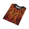 Fiery oranges, reds, and black flames cover this patterned tee shirt with an intense, all-over design.