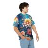 Vibrant floral all over print sublimation tee featuring large yellow and pink dahlia flowers with blue galaxy background.