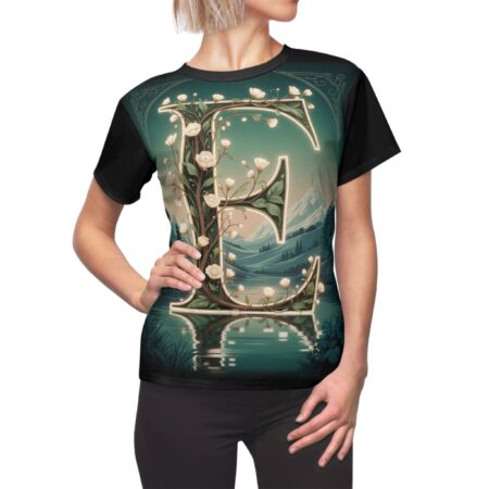 All over print sublimation tee showcasing a large floral letter 'E' set against a serene landscape with mountains and a lake.