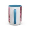 Floral "Mom Life" ceramic coffee mug with blue interior and handle, adorned with pink flowers and gold accents.