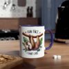 White ceramic mug with a purple handle, featuring a cartoon sloth hanging from a branch with the words "FUN FACT" and "I DON'T CARE."