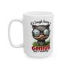 White ceramic mug with a grumpy cat wearing glasses, holding a pencil, and grass.
