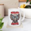White mug with a cartoon elephant wearing glasses and the text