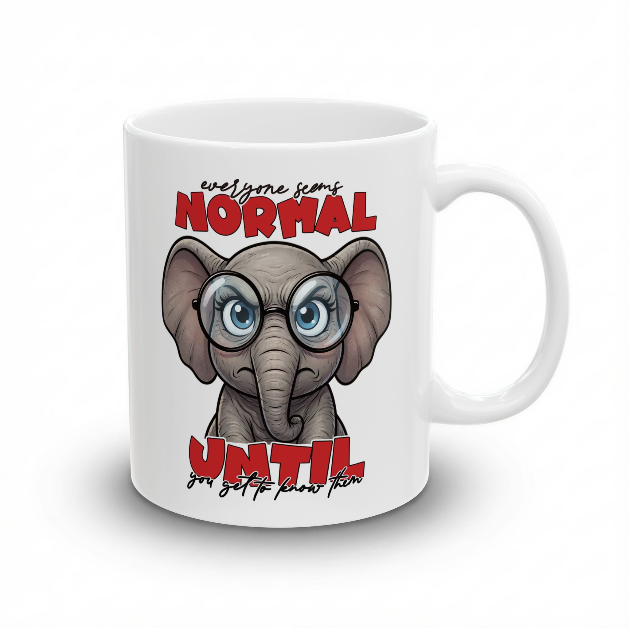 White ceramic mug with a grumpy cartoon elephant wearing glasses, text reads "everyone seems NORMAL UNTIL you get to know them".