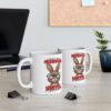 Two white ceramic coffee mugs with a sarcastic rabbit illustration and text.