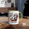 White ceramic mug with a vivid green handle and rim, featuring a cute sloth illustration enjoying coffee.