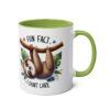 White ceramic mug with a green interior and handle. Features a sloth graphic with text "FUN FACT" and "I DON'T CARE".