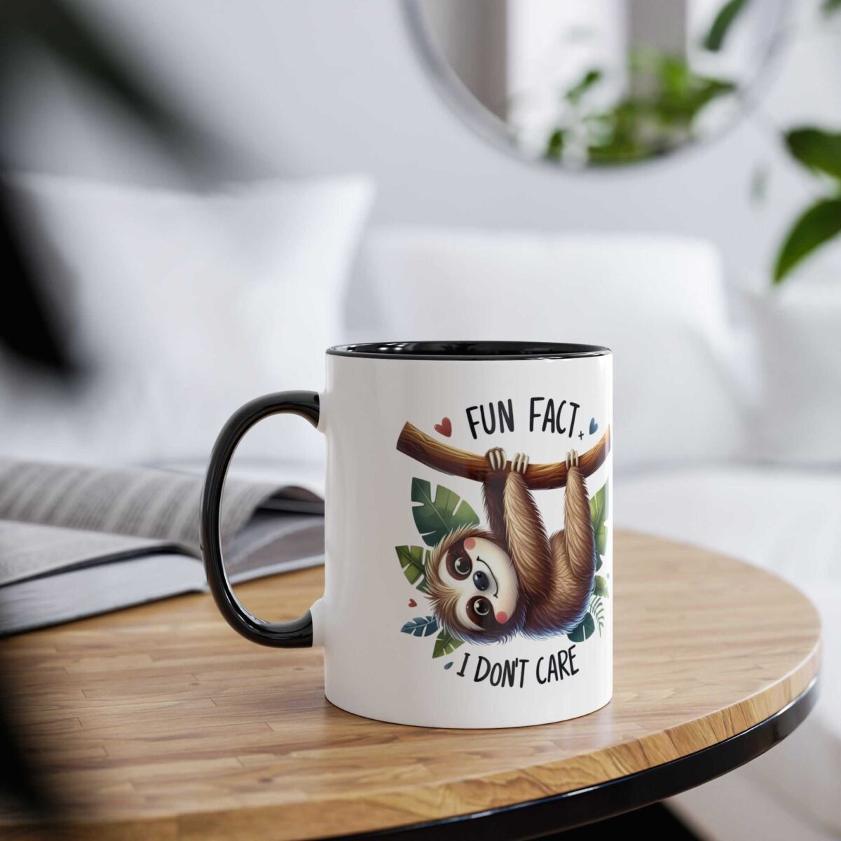 White ceramic mug featuring a cute sloth hanging from a branch with text 'FUN FACT I DON'T CARE'.