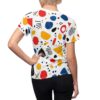 Retro repeat print, all over print t-shirt with abstract geometric shapes: red circles, yellow ovals, blue stippled forms, black lines, seamless sublimation design.
