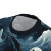Teal and white swirling patterns with ghostly figures and dark branches cover this seamless pattern tee, set against a deep blue, misty background with scattered orange accents.