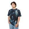 Ethereal white and blue ghosts with black eyes float amongst dark, shadowy trees and misty wisps on this all-over print t-shirt.