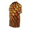 Golden and orange scales with textured detail cover this patterned tee shirt, giving a fierce fantasy vibe.