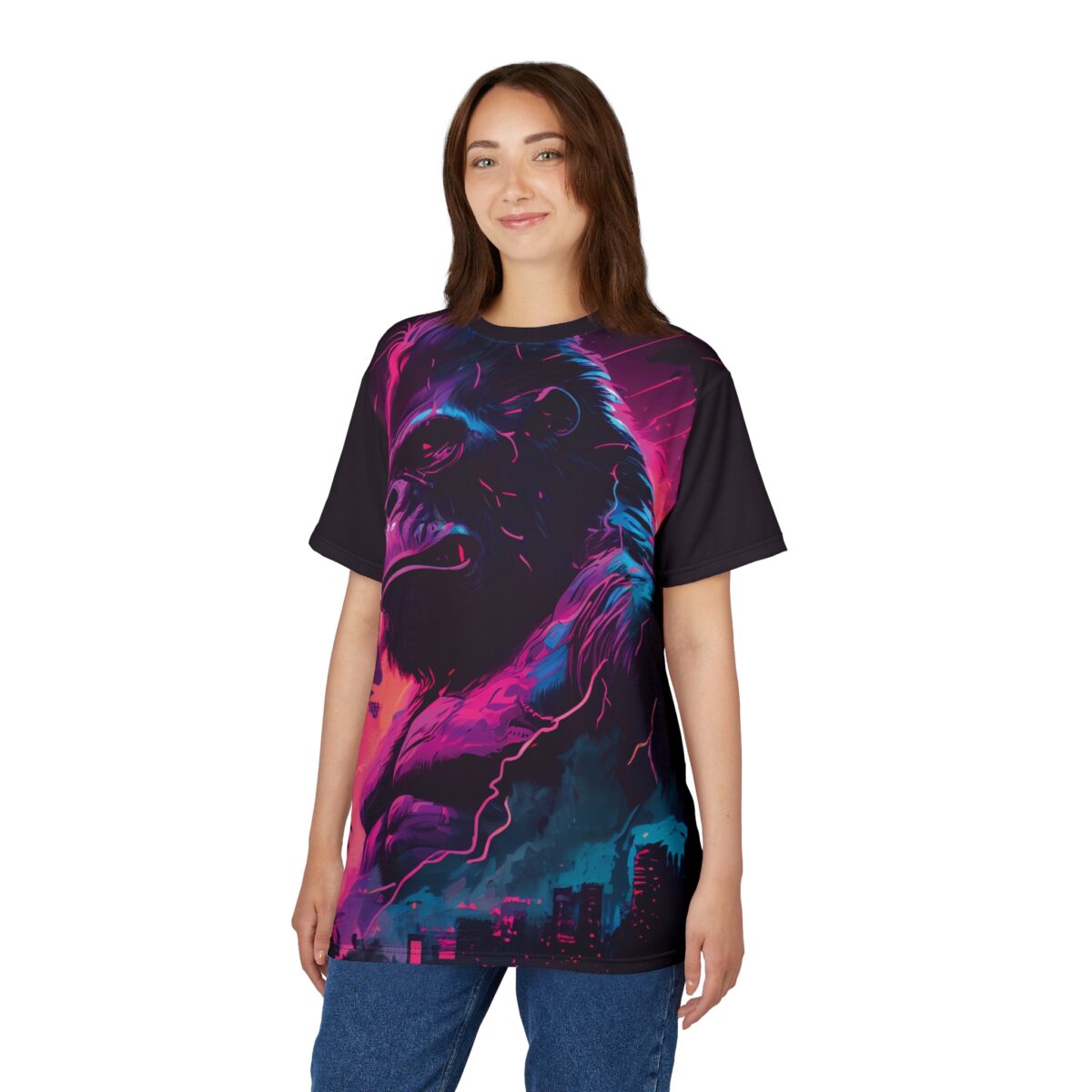 Neon pink, electric blue, and deep purple hues cover this patterned tee shirt, depicting a powerful gorilla in a street art style against a cityscape.